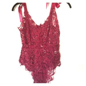 Burgundy lacy body suit.